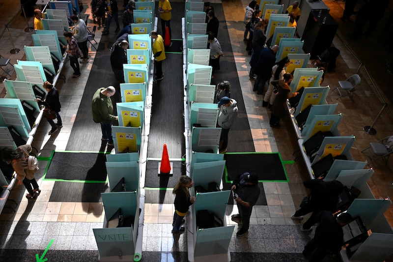 Lines of voting machines are in shadow