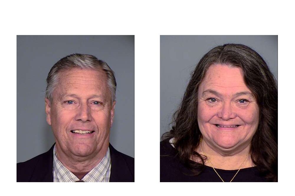 One man with short hair, left, and one woman with medium dark hair both smile at the camera - these are mugshots.