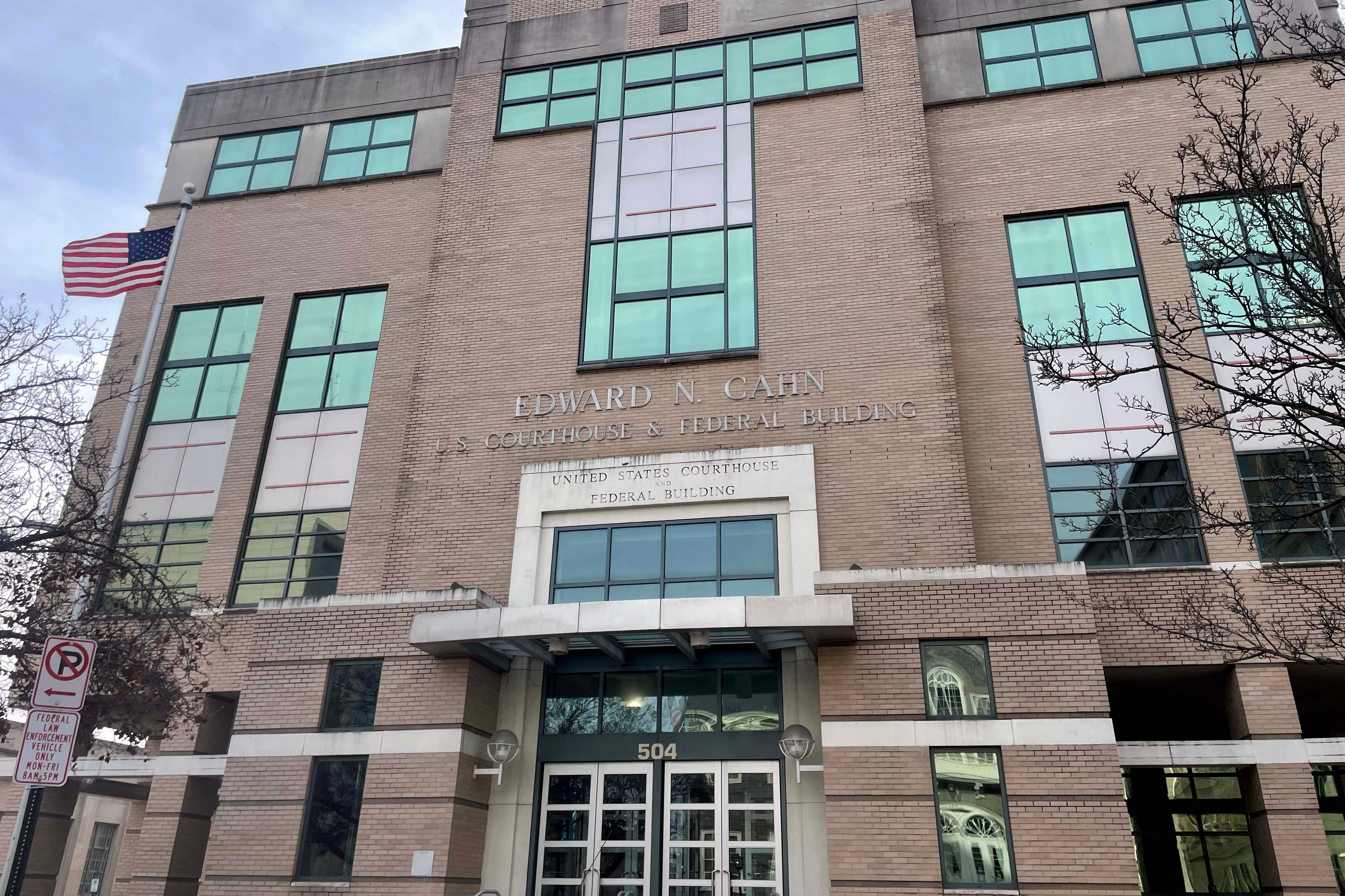 A photograph of the exterior of a large stone building.