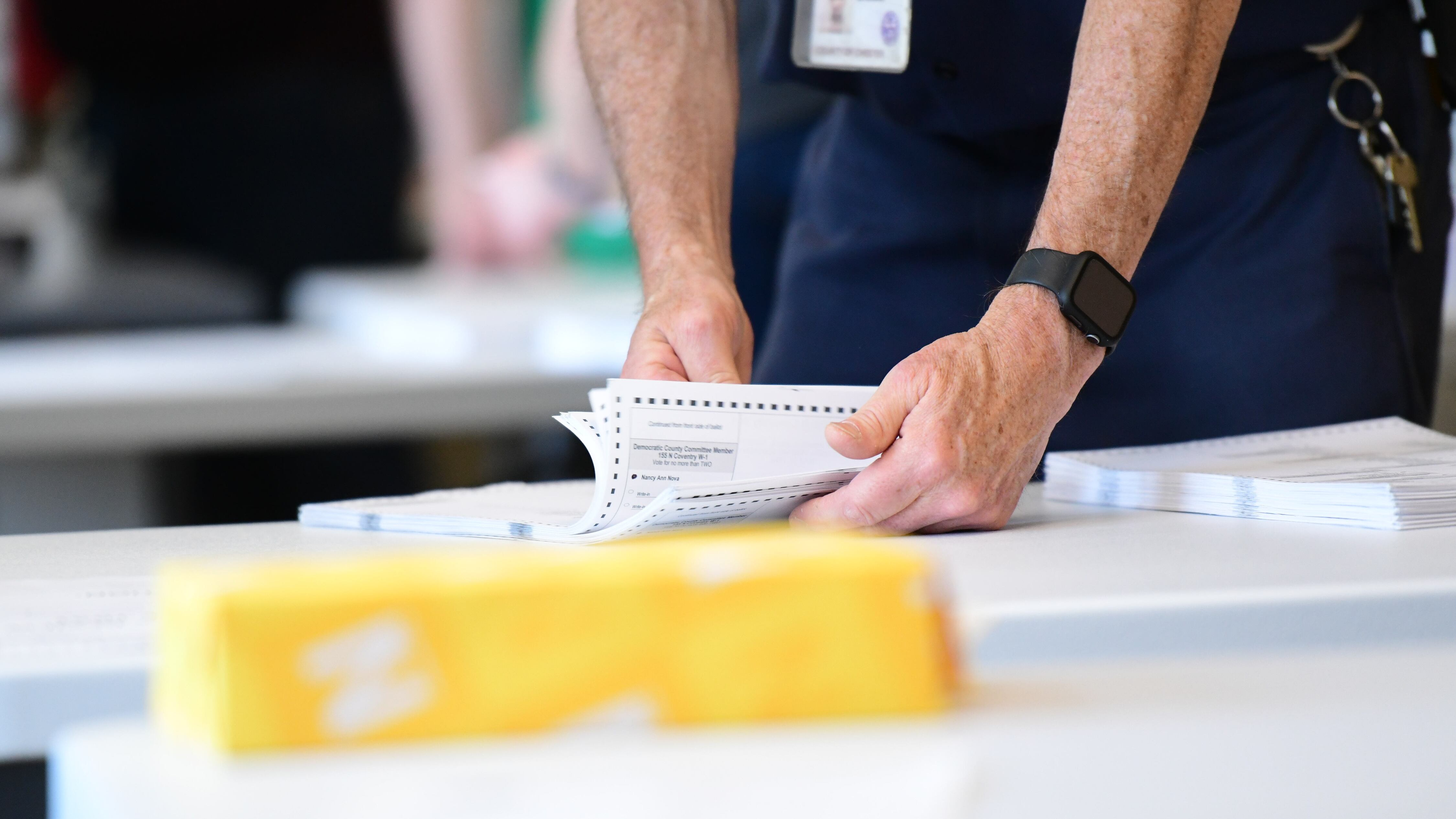 County officials perform a ballot recount on June 2, 2022 in West Chester, Pennsylvania.