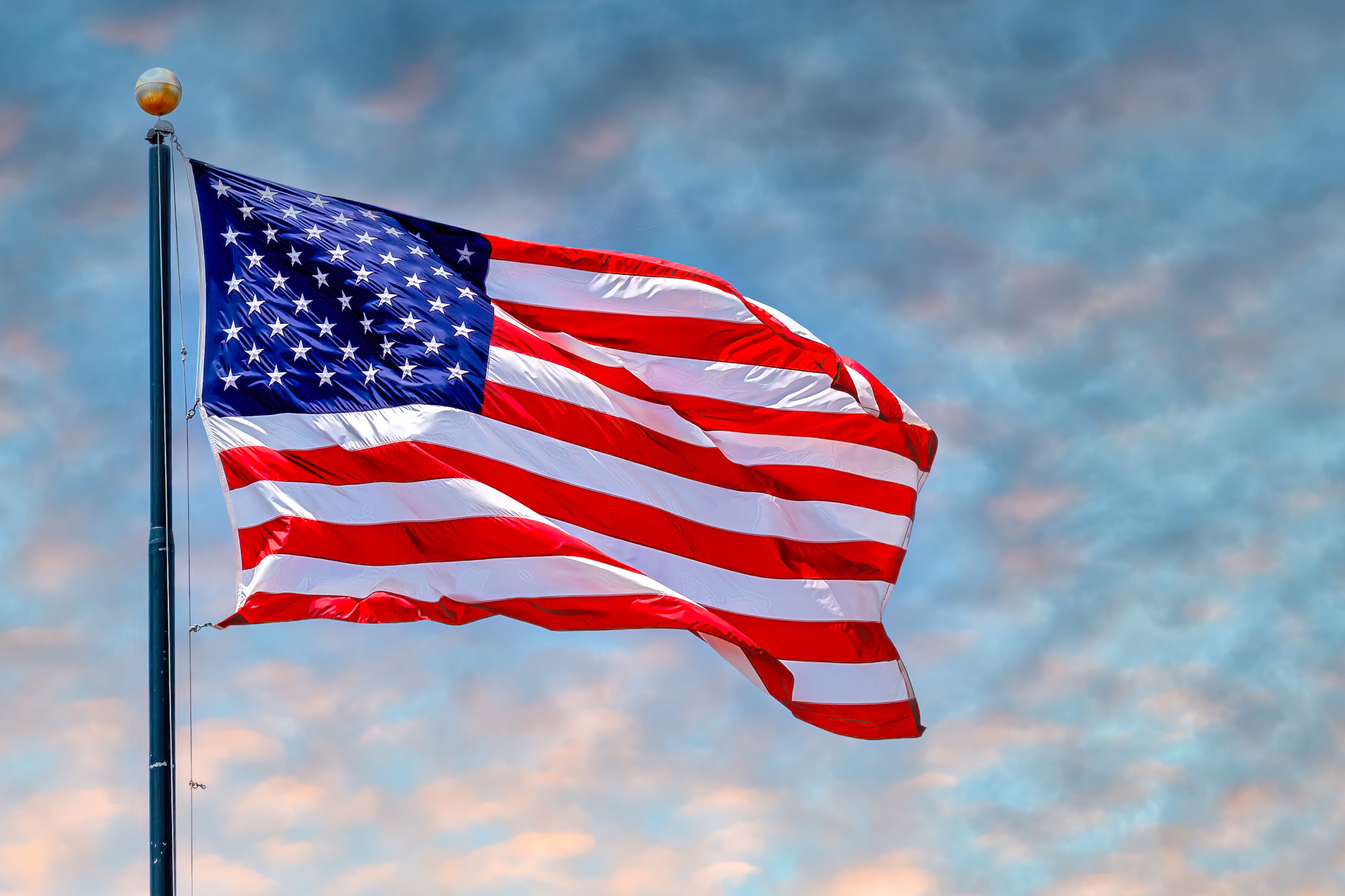 An American flag blows in the wind.