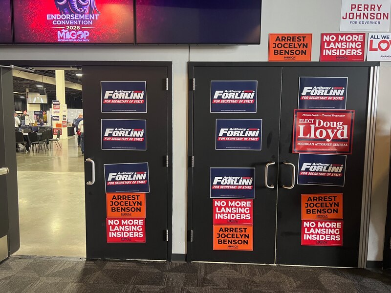 Doors plastered with campaign signs for candidates such as Anthony Forlini and Monica Yatooma.