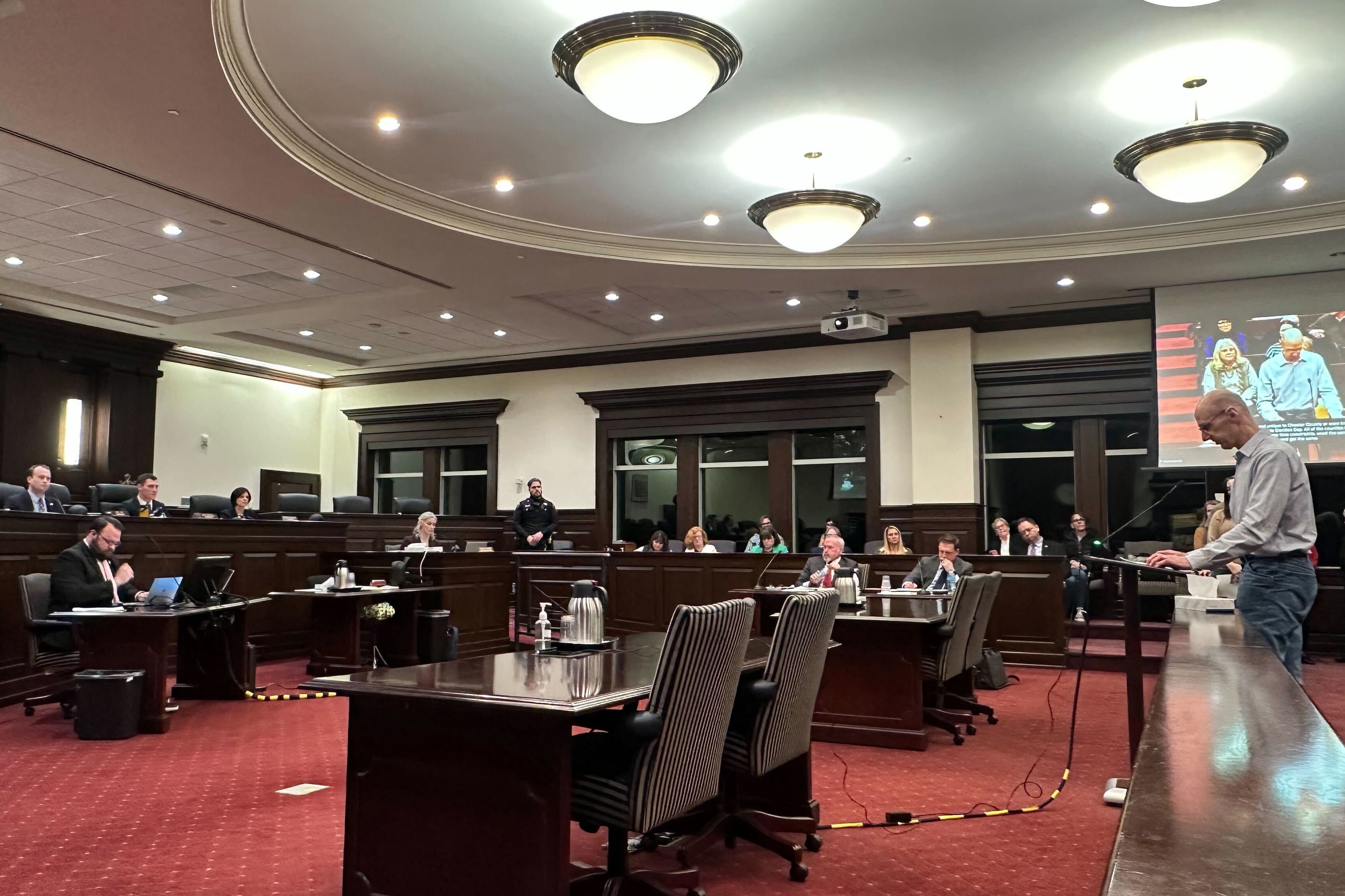 A photograph of a large meeting room.