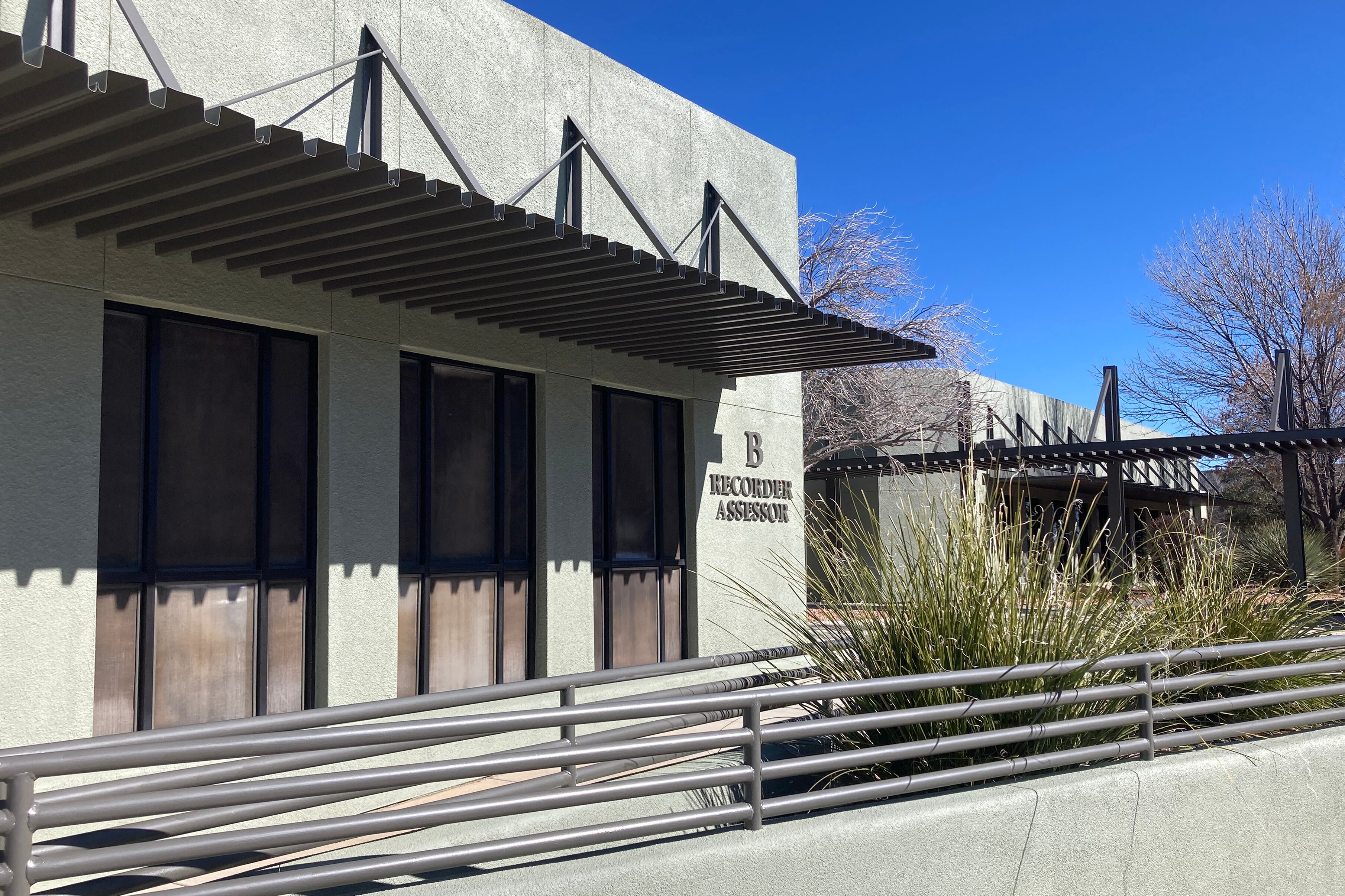 A green stone building outside.