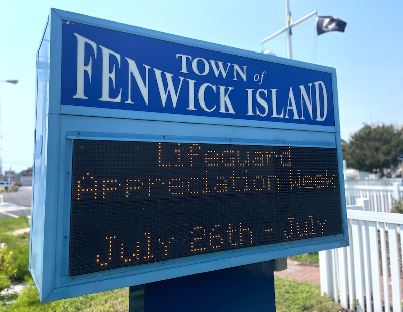A blue-and-white sign.