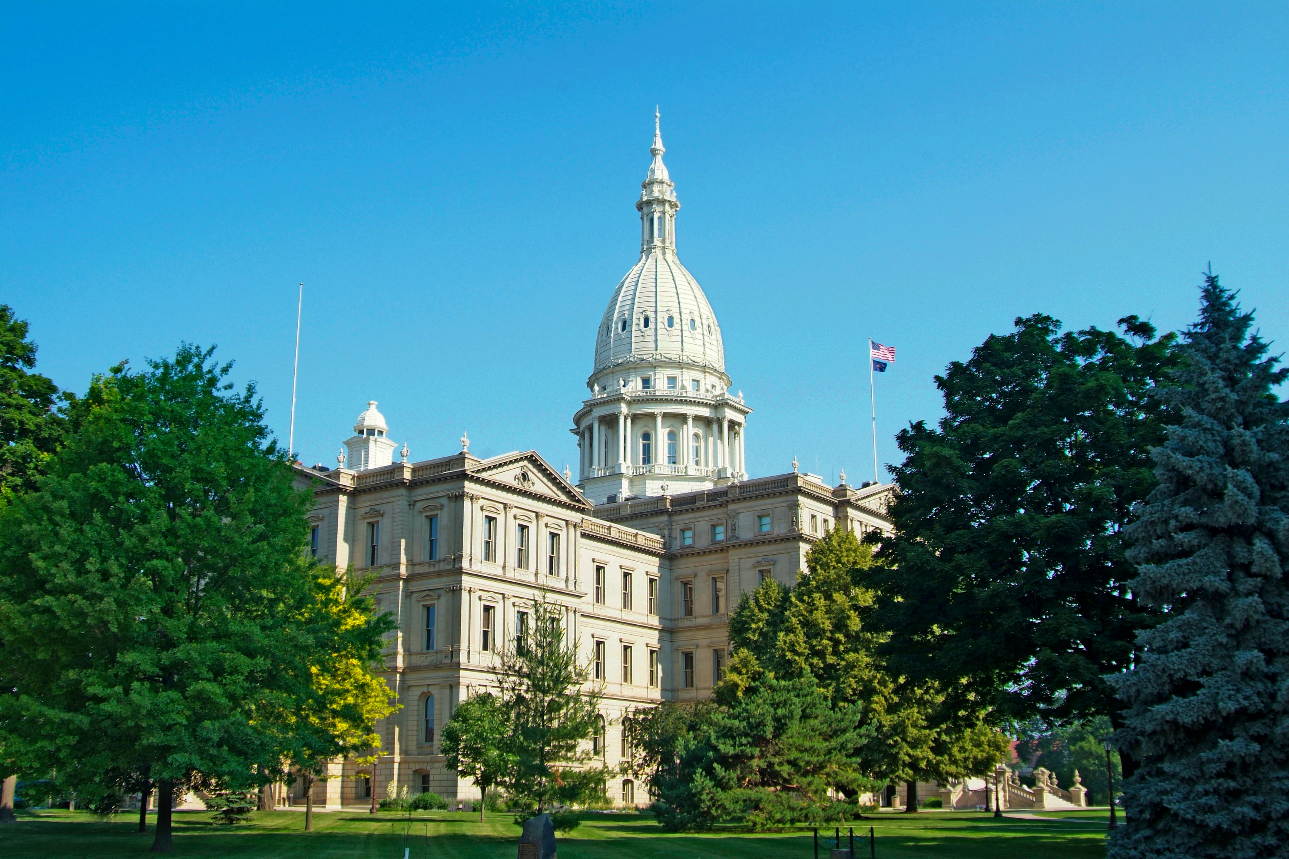 A white building with dome on the top