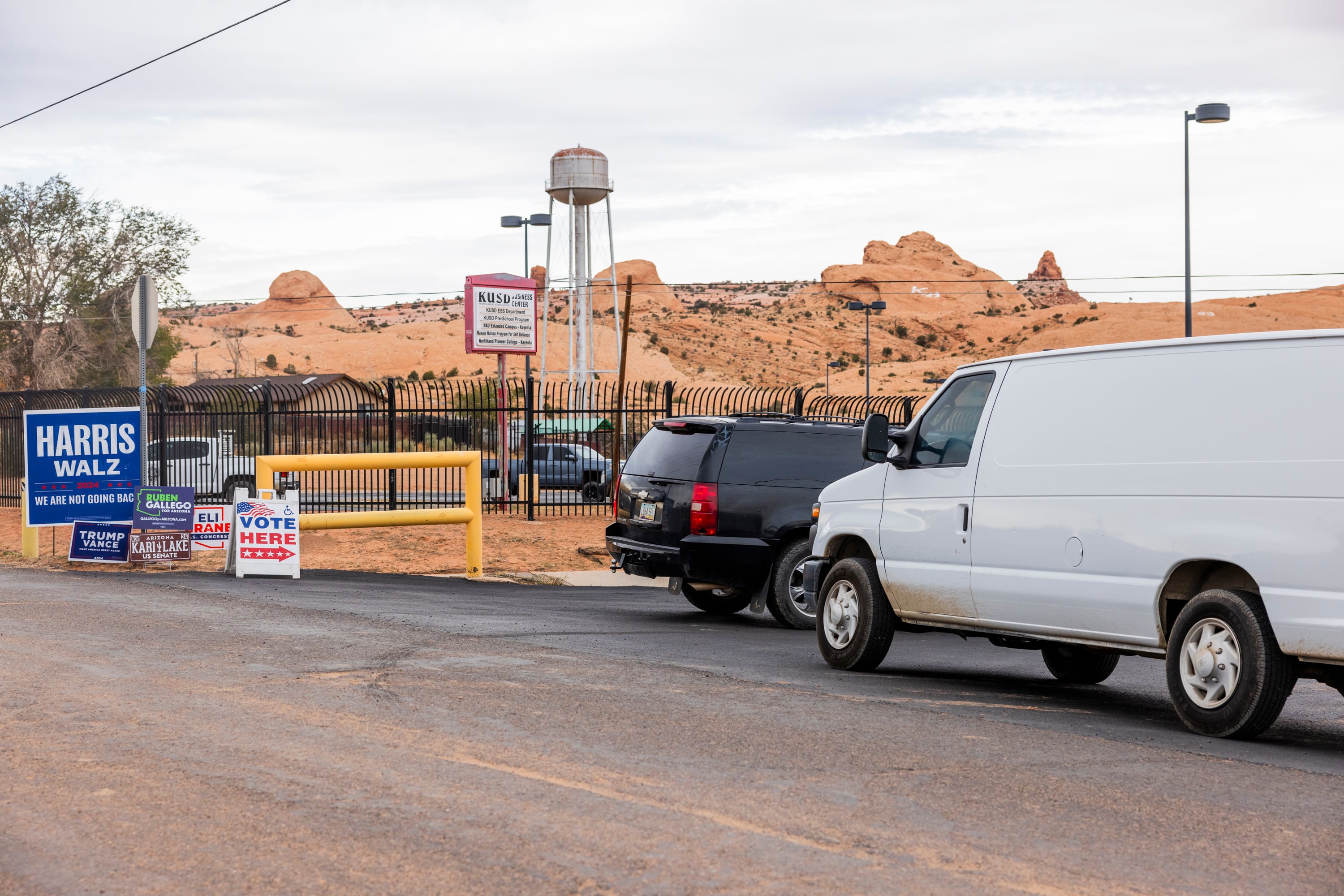 Political signs and emergency vehicles outside a polling station at the Navajo Reservation.