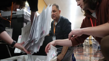 Trump administration warns Chinese-made parts in voting equipment pose risk, but experts say dangers remain low.