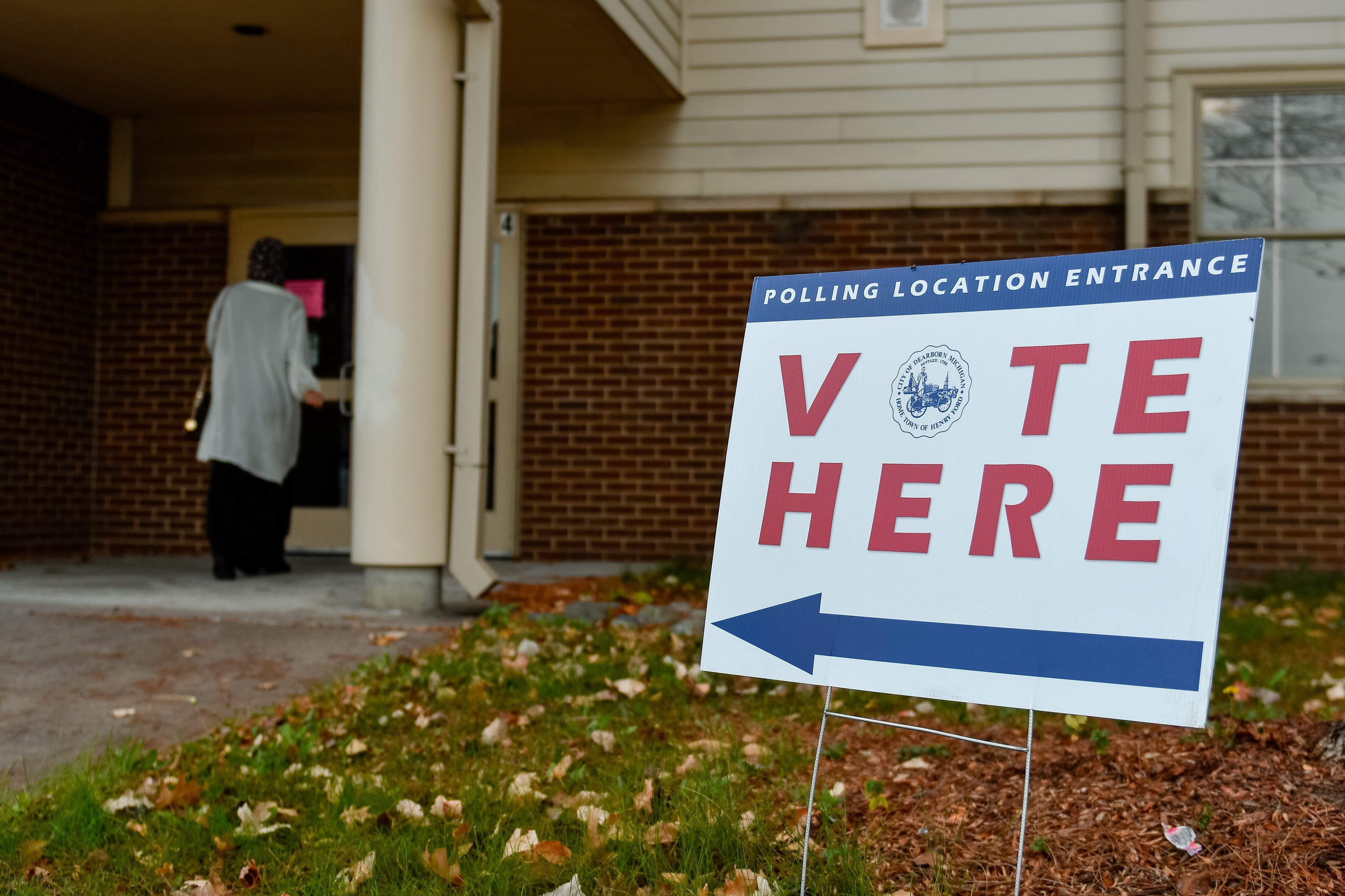 A vote sign sits outside a polling location.