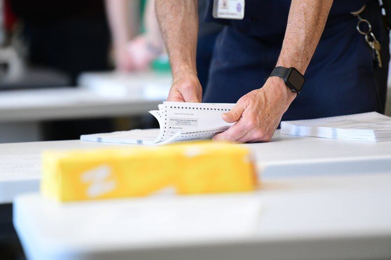 County officials perform a ballot recount on June 2, 2022 in West Chester, Pennsylvania.